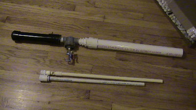The gun with the GB barrel attached, below are the PB barrel, and 1/2'' inch barrel for marbles.