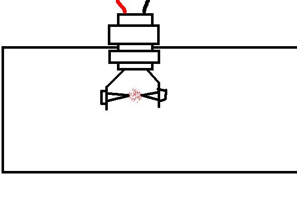 Just a section of threaded pipe secured by plastic rings on each side, with a spark gap suspended inside.