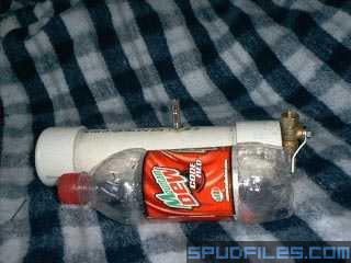 Here it is. After a whole three days of drawing, cutting, and glueing, the Atom Project is finished. Made of 2&amp;quot; PVC that houses a homemade fixed diaphragm, it takes the idea of my KingPin design to a much smaller level. I opted for a mechanical firing system this time to eliminate the bulk of a solenoid and 9v battery, not to mention all the custom work that goes along with it! It's practically foolproof.<br /><br />Impressive, no? Measuring in at a mammoth 11 inches, the Atom Project barely dwarfs this 20oz soda bottle. Striking fear into mortals that gaze upon it.