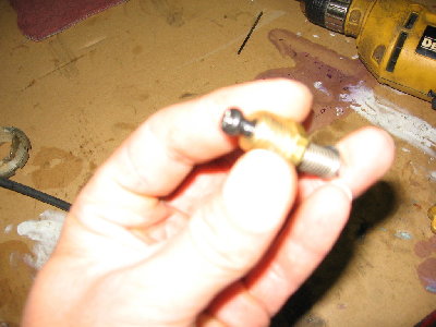 showing what happens when you depress the button...<br /><br />this is my second one, the bolt is a little long and it uses a differant spring than my first, but a made this one just for illustrating the construction method...