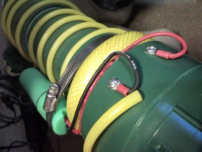 The yellow airhose tubing hides the wires. I moved it aside to show the wire routing