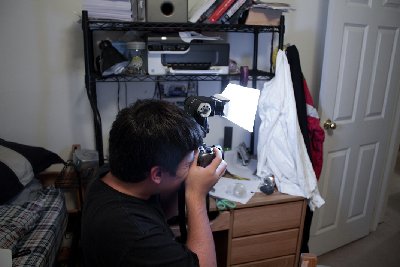 Here is the flash I used. It is a Vivitar 285HV auto-professional flash. The light diffuser you see lit up is home made and made of plain printing paper and tape