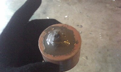 Piston washer and nut.  Used JB Weld to seal the bolt hole.