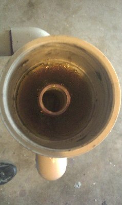 Serviceable piston end cap, reinforced with epoxy and filled so that it is flush.