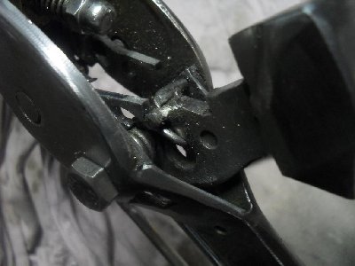 Normal cocked position.When rear of trigger rotates up the hammer can swing forward.