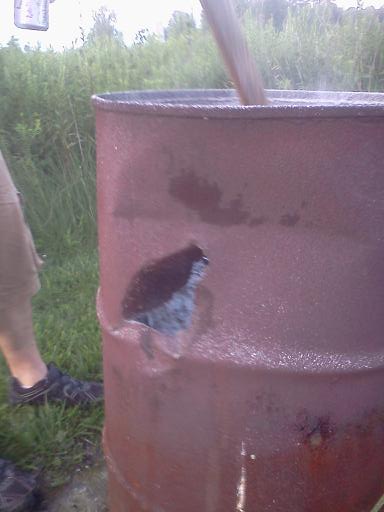 Here's a damage shot on a 55 gallon drum used for a fire barrel. I WISH I had that shot on video... the sound was great, and the plume of ash that flew up out of the barrel looked like an explosion.