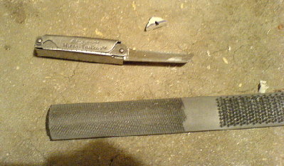 Using these.  Mini-sawblade and a file.