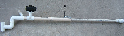 A side view of the rifle with the bolt in the unloaded position