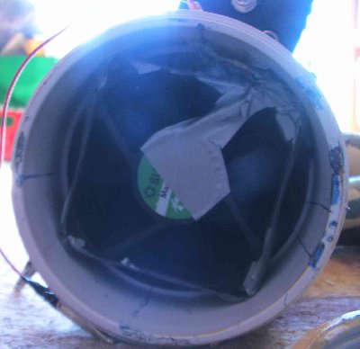 fan. wedged in by filling corners with duct tape- no extra holes in chamber