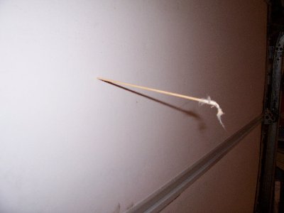 the q-tip stuck in