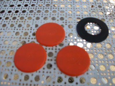 These are the burst disks and rubber washer I use to make the seal.  The disks are grinded down Gatorade tops and the rubber came from a radiator cap.